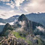Machu Picchu citadel and Huayna Picchu in misty Andes clouds, Peru