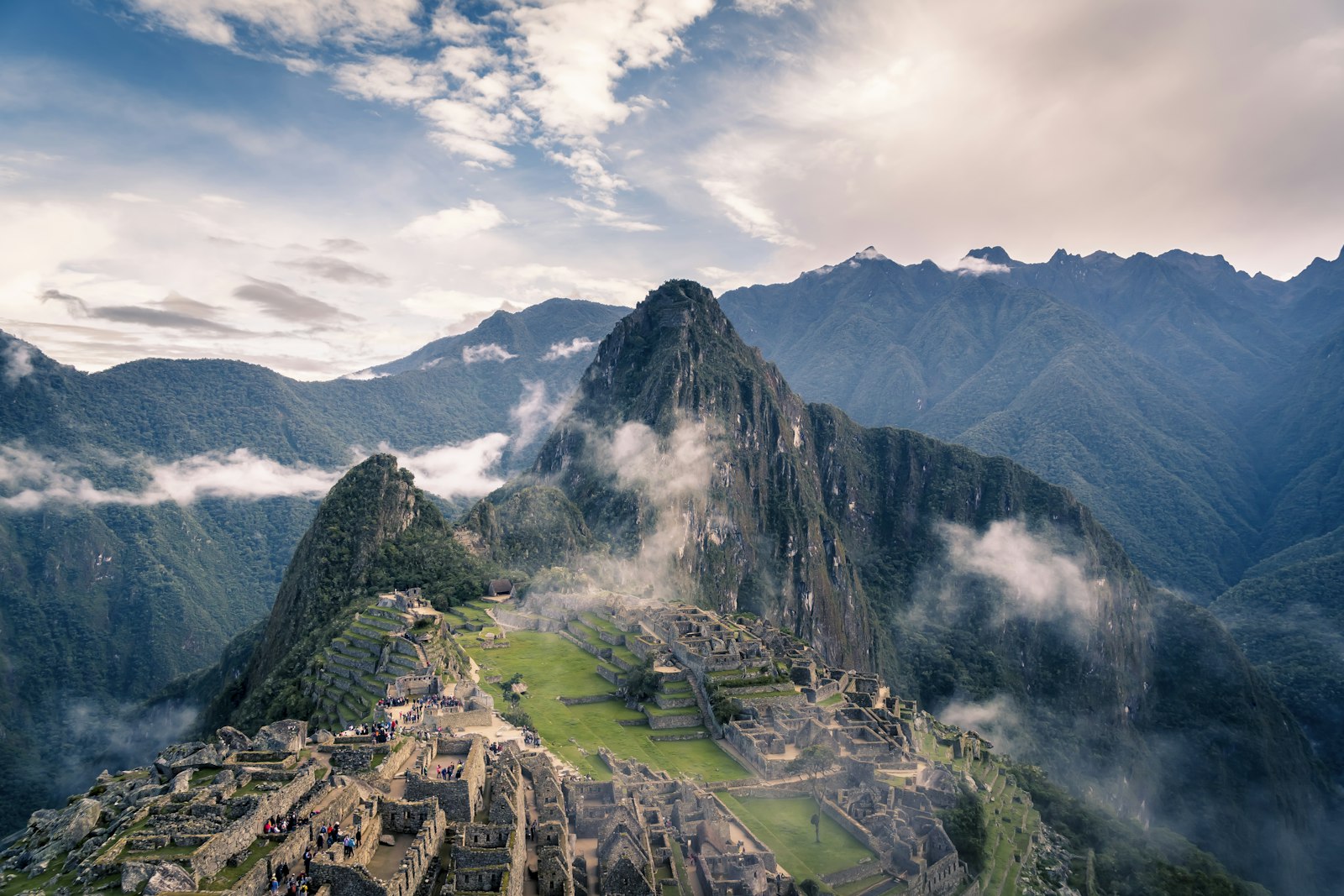 Machu Picchu citadel and Huayna Picchu in misty Andes clouds, Peru