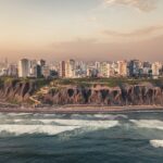 Coastal cliffs and green parks along the Miraflores malecón in Lima at sunset