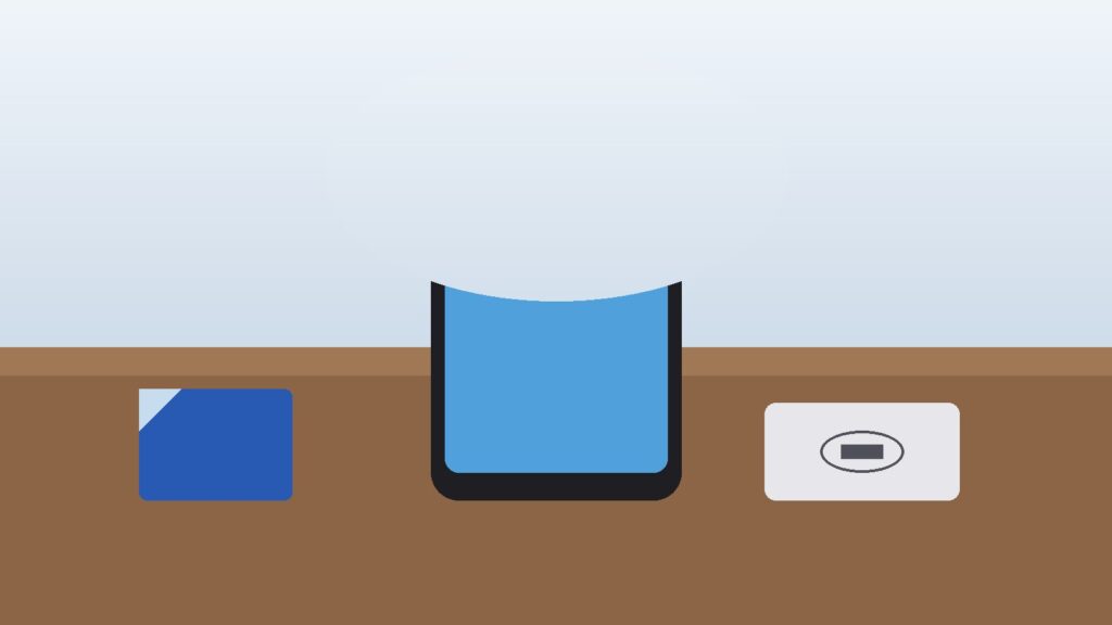 Smartphone with signal bars beside a SIM card on a travel desk
